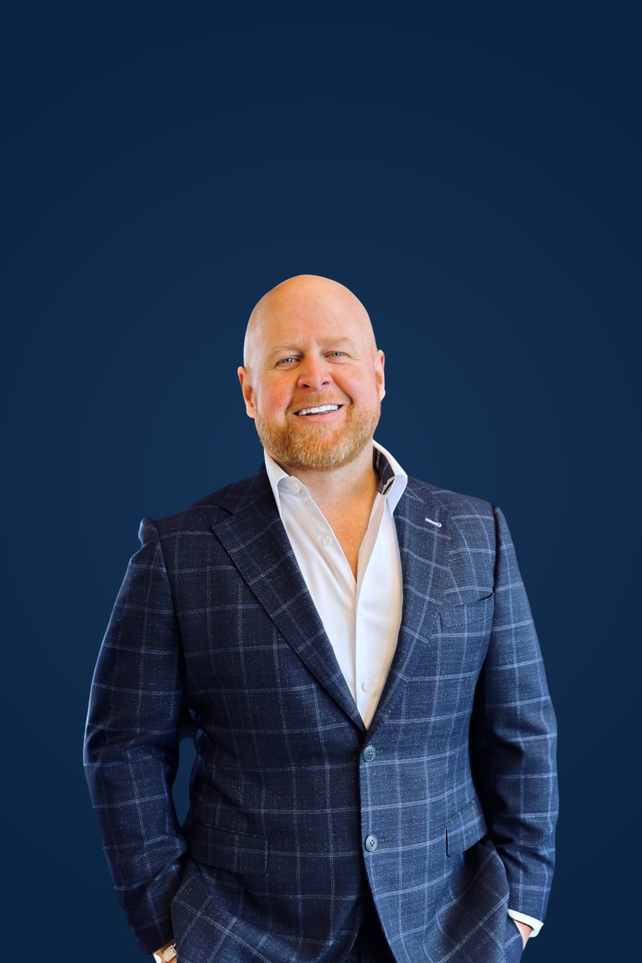 Canadian mortgage broker, Dave Butler, wearing a buttoned up suit with hands in pockets